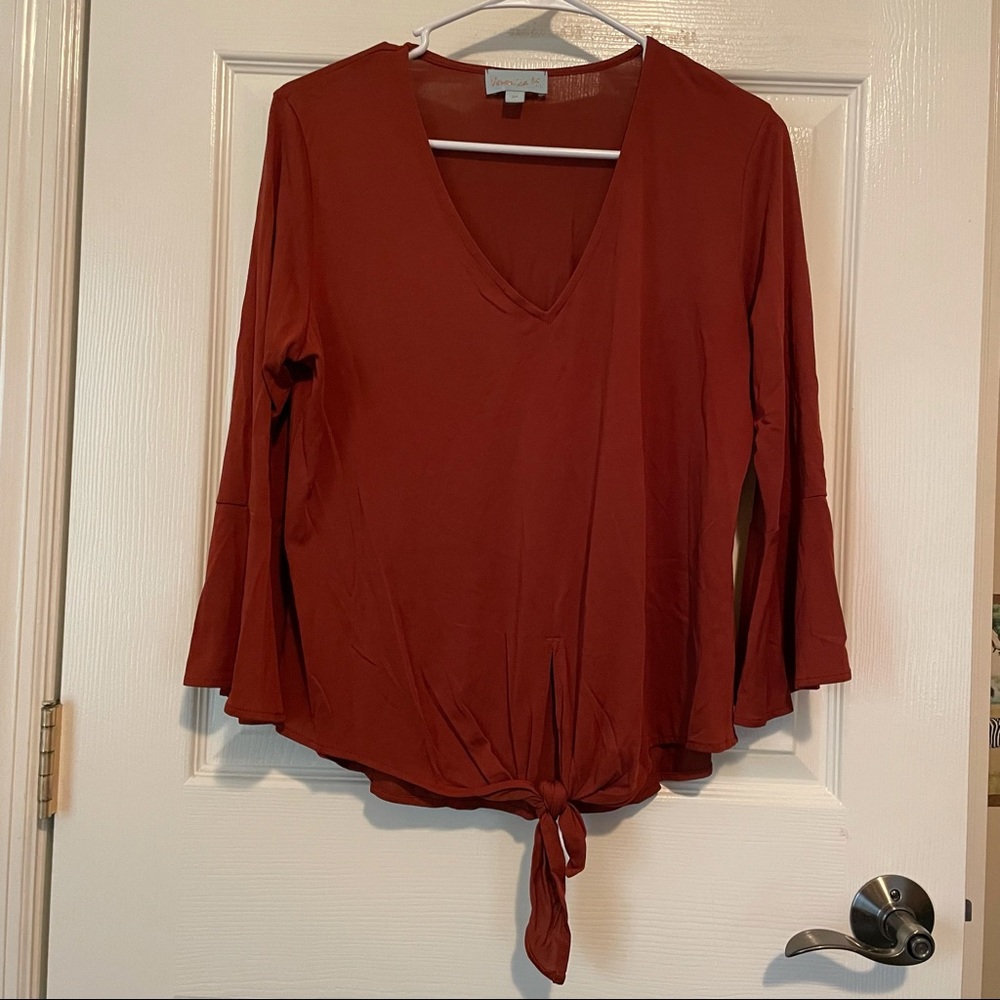 Veronica M, burnt orange color, medium. Excellent condition.